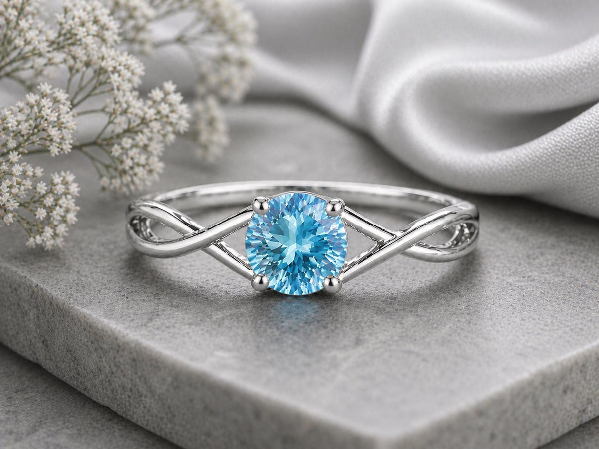 Swiss Blue Topaz Ring, Sterling Silver Infinity Twist Solitaire, Round Cut Gemstone