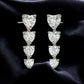Sterling Silver Heart CZ Dangle Earrings: Romantic Statement Jewelry
