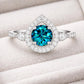 London Blue Topaz Ring | Pear Halo, 925 Sterling Silver
