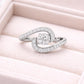 Sterling Silver Swirl Ring – Round CZ Pavé Bypass Design