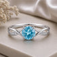 Swiss Blue Topaz Infinity Ring, Sterling Silver Solitaire with CZ Accents